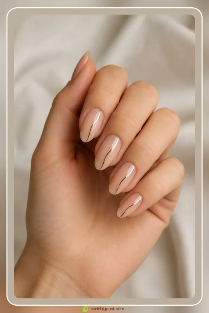 Simple gold nails with one thin accent line on bare base