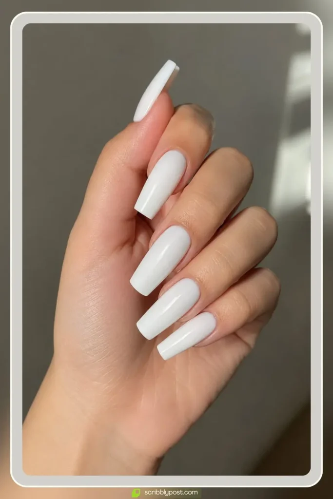 Long white acrylic nails in sculpted extension set