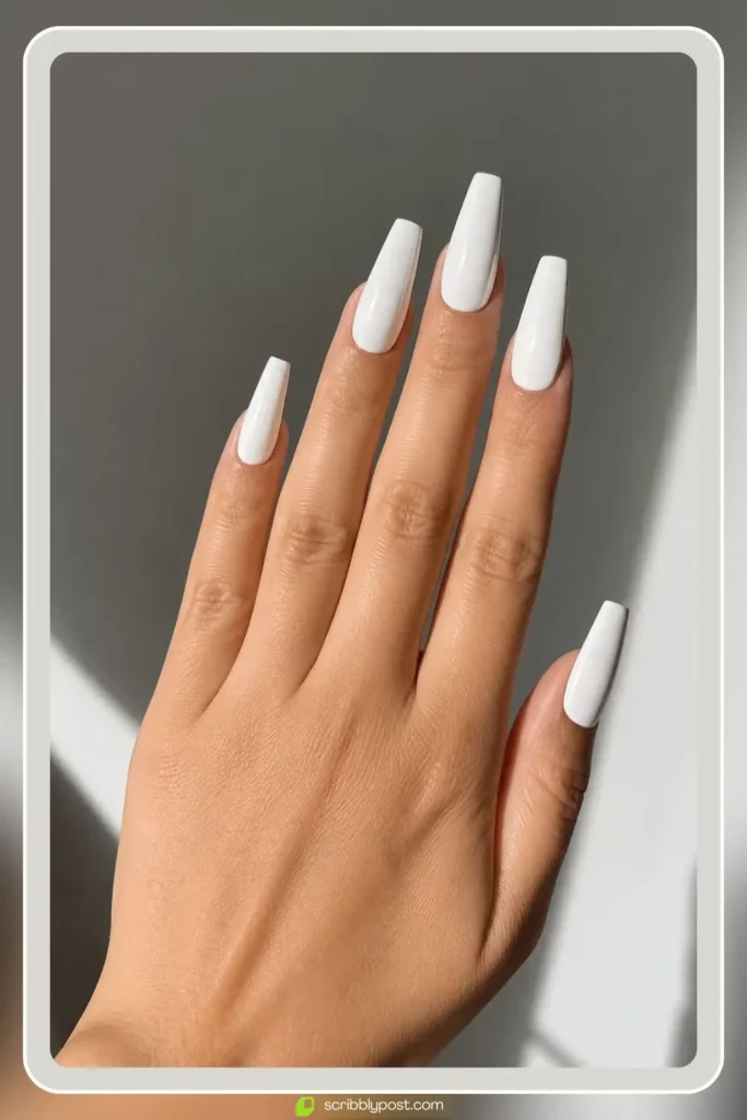 White coffin nails in long tapered shape with glossy finish
