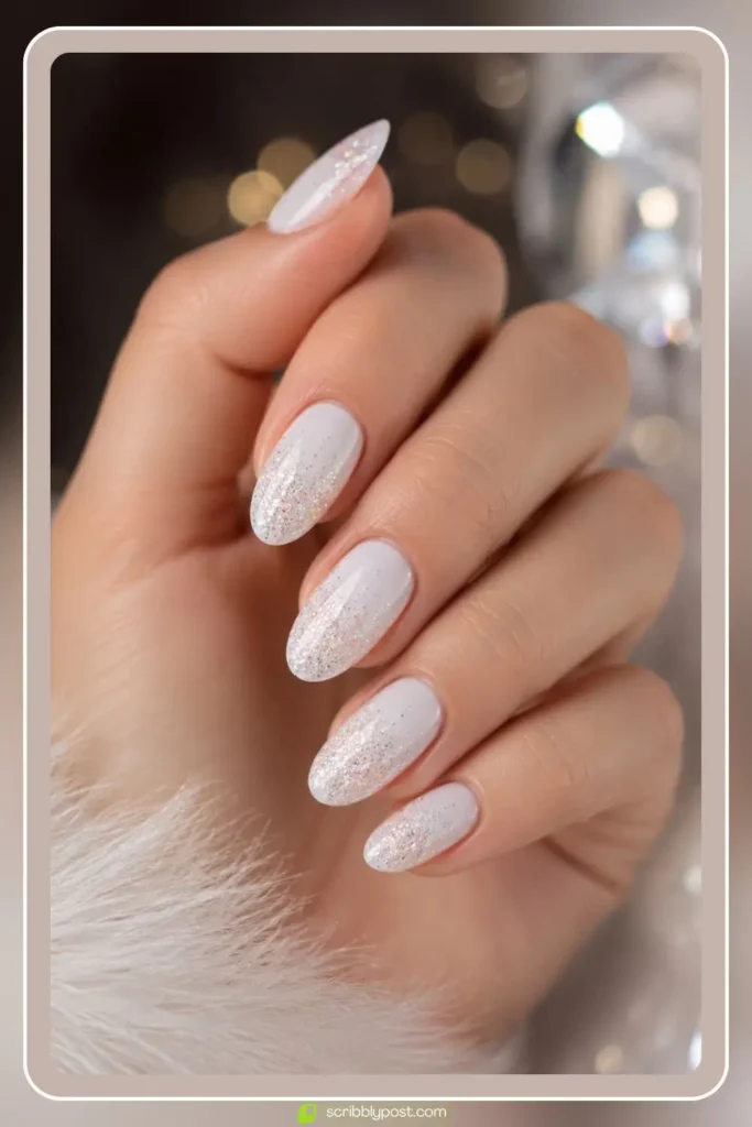 White glitter nails with iridescent sparkle over white base