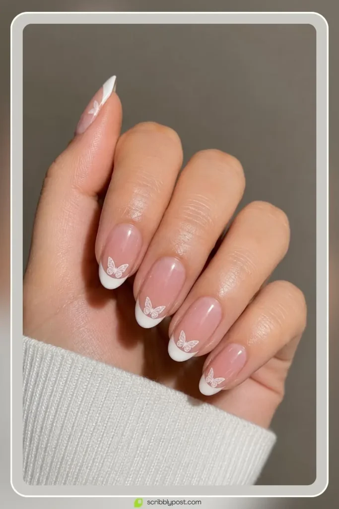 Butterfly Nails Explained: The Technique Plus 15 Designs for 2026 5 Butterfly french tip nails with tiny wings at the smile line