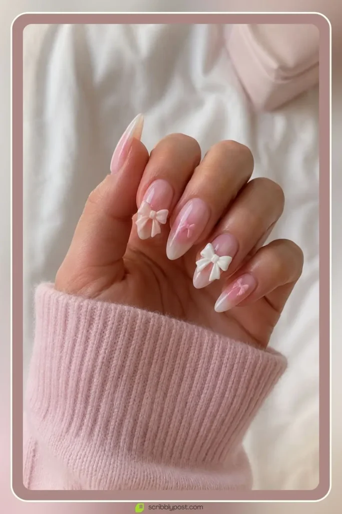 Coquette bow almond nails in white and pink dimensional finish