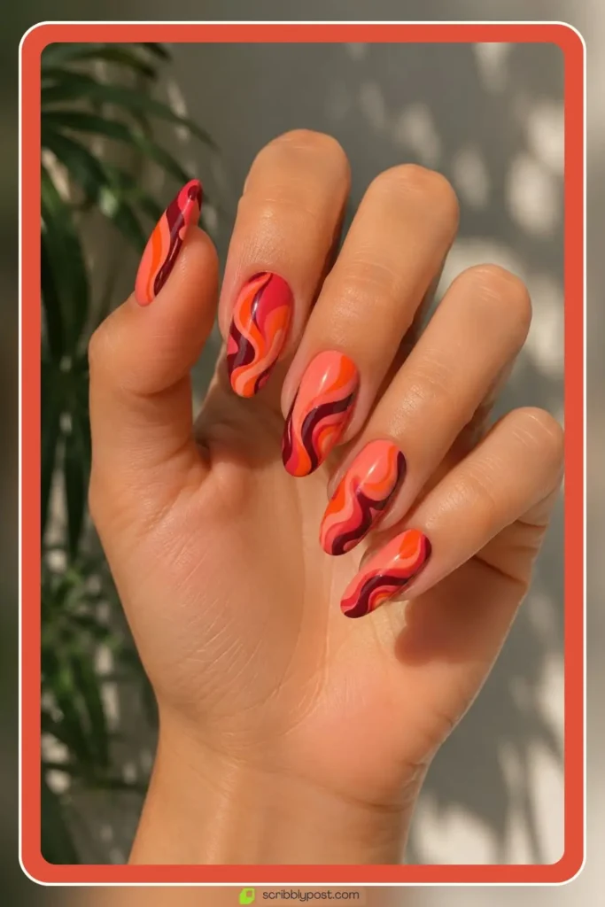 Coral swirl abstract nails with bold pattern design