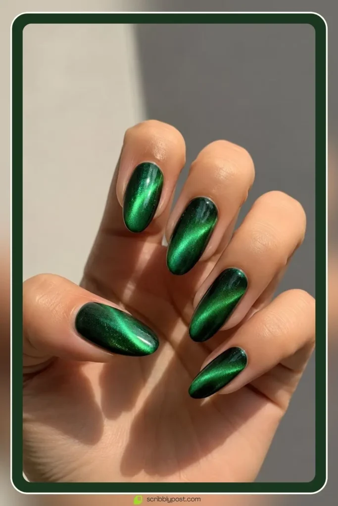 September Nails: The Only Month Where the Birthstone and the Trend Are the Same Color 9 Emerald cat eye nails with glowing jewel toned shimmer