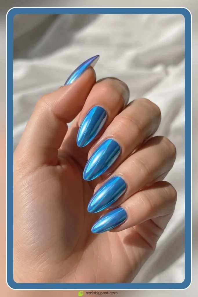 Mermaid Nails Decoded: 16 Ocean-Inspired Sets for 2026 41 Mermaid blue chrome nails combining color and shimmer finish