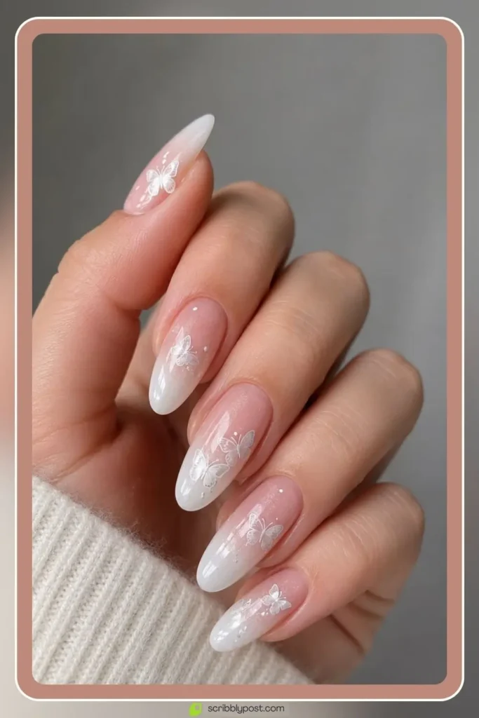 Butterfly Nails Explained: The Technique Plus 15 Designs for 2026 33 Ombre butterfly nails fading from nude to white with sticker wings