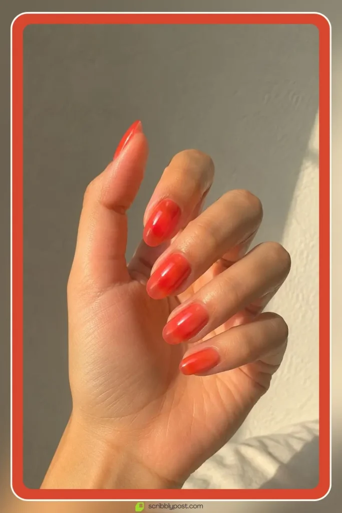 Twizzle sheer red orange nails with juicy translucent finish