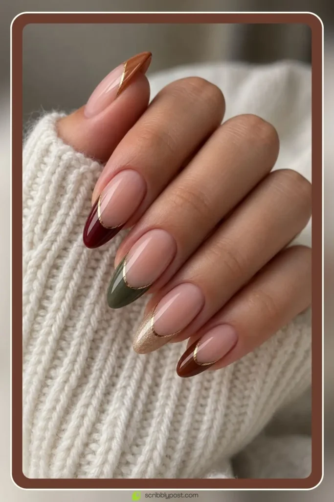 Multi coloured French tips with a gold accent, a fall nails ideas set on short nails