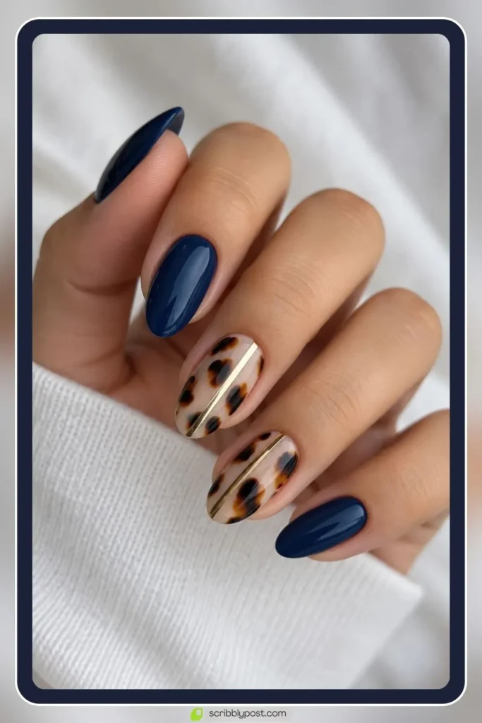 Navy blue and tortoiseshell autumn fall nails on a long almond shape