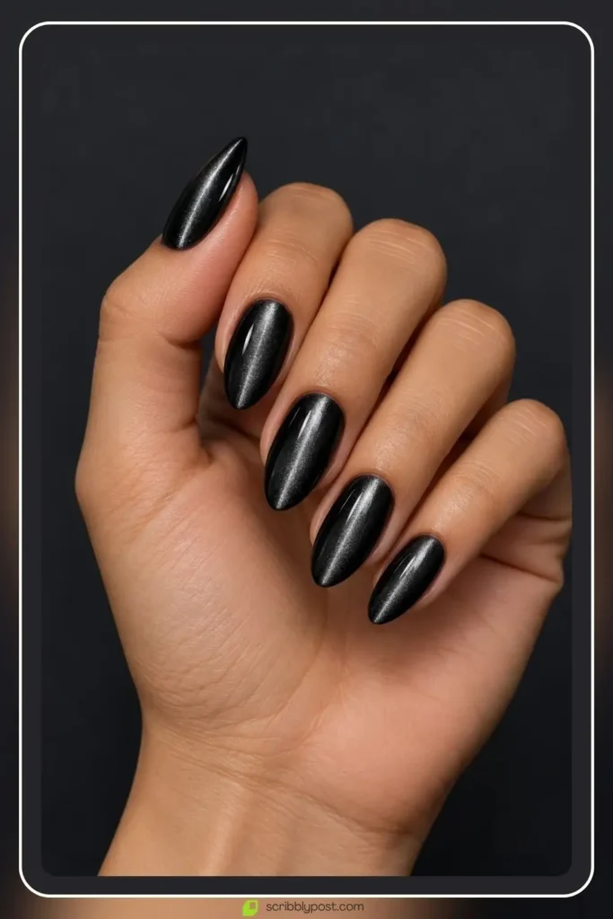 The Halloween Nail Scale: Five Levels from Nobody Would Know to Full Spooky 3 Halloween cat eye nails in black magnetic gel with a band of light across each nail