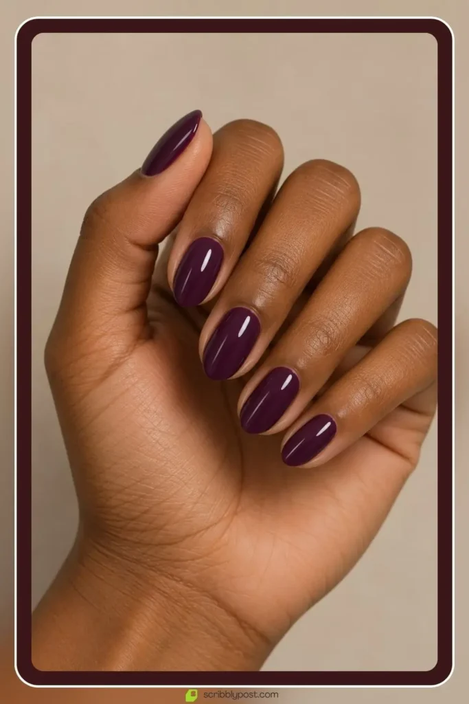 The Halloween Nail Scale: Five Levels from Nobody Would Know to Full Spooky 2 Deep plum halloween nails on a short almond shape with a glossy autumnal finish