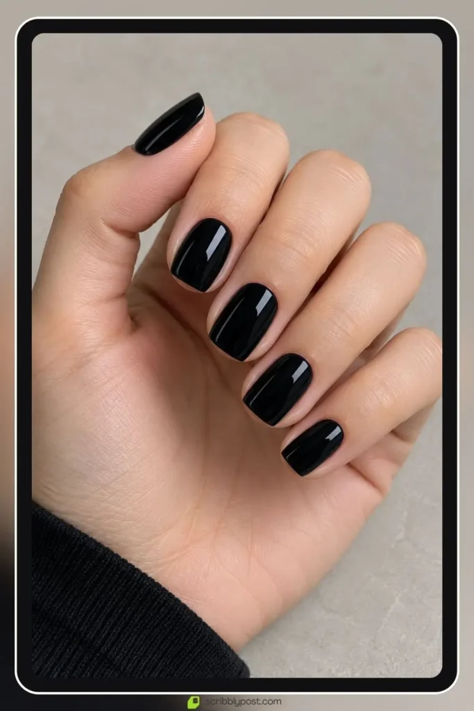 The Halloween Nail Scale: Five Levels from Nobody Would Know to Full Spooky 1 Black halloween nails in glossy jet black on a short square shape with no nail art