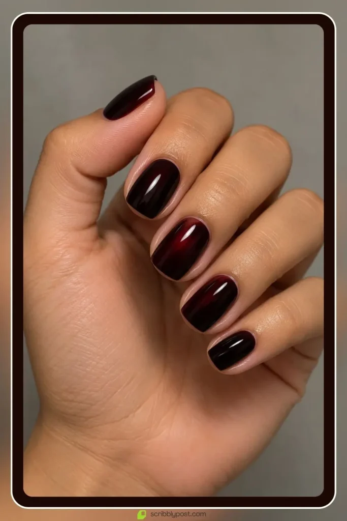The October Nail Plan: What to Book, When, and How to Fit Halloween Into It 1 October nails in rouge noir, a dark red that reads black indoors, on a short squoval shape